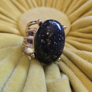 Gold ring with black stone